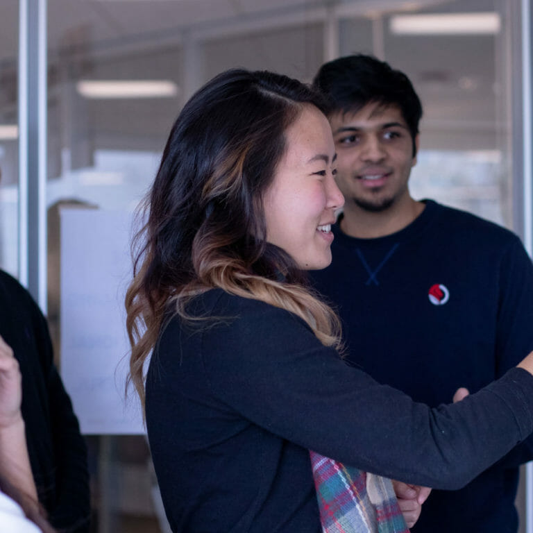 PI employees doing a trust building exercise