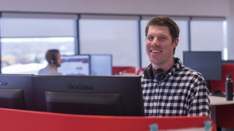 man working on his computer in the Predictive Index office