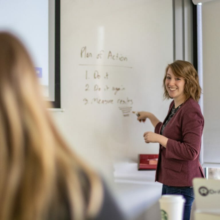 Woman smiling and presenting