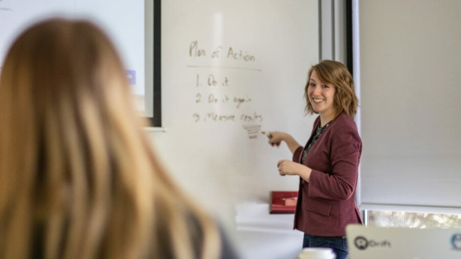 Woman smiling and presenting