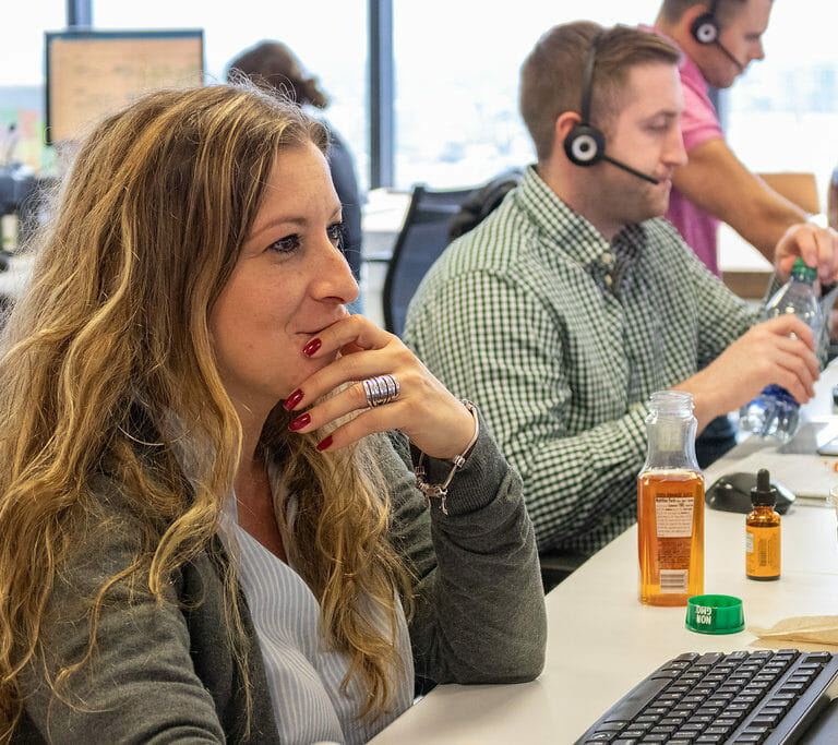 two employees with headsets