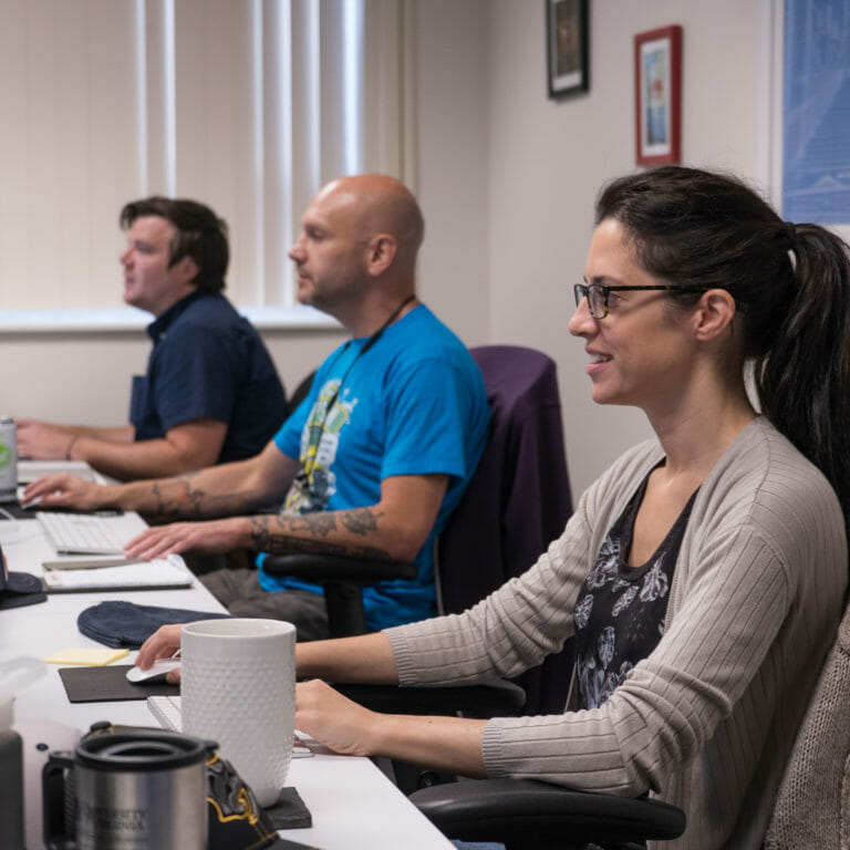 Happy engaged employees at desks