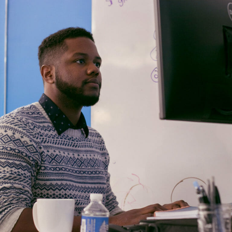 tech employee working at his desk