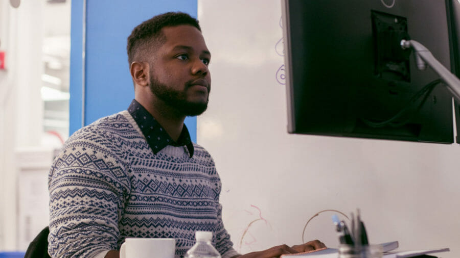 tech employee working at his desk