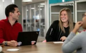 employees laughing in office