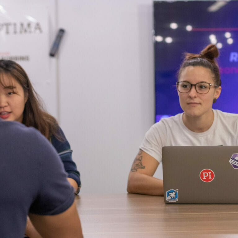 A group of people collaborating to discover their business team type.