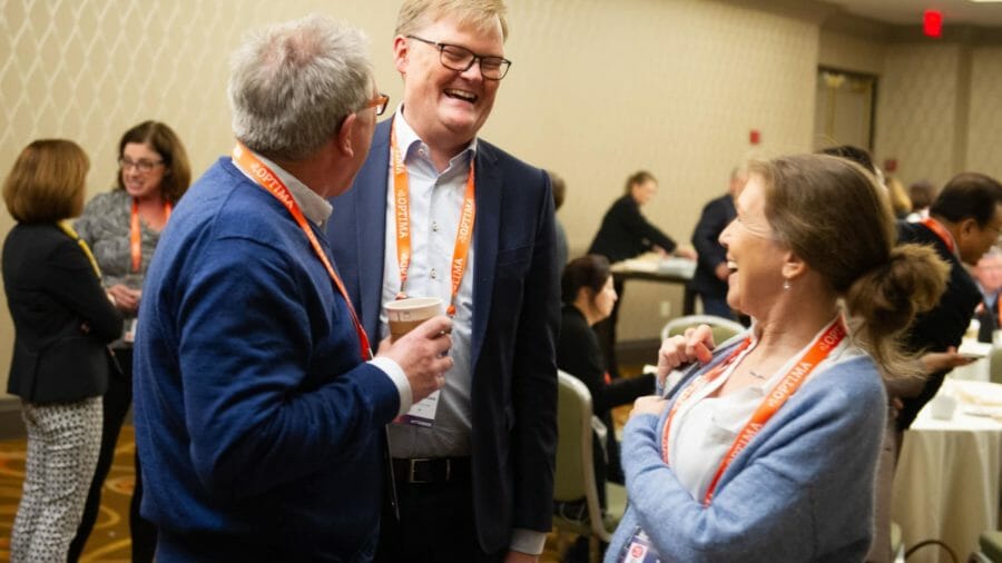 Consultants talking at the OPTIMA 2019 conference