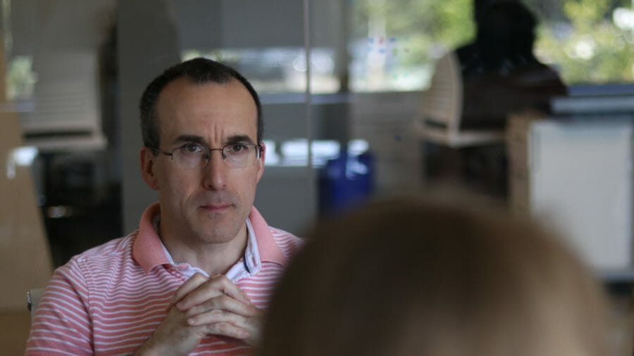 man listening in group