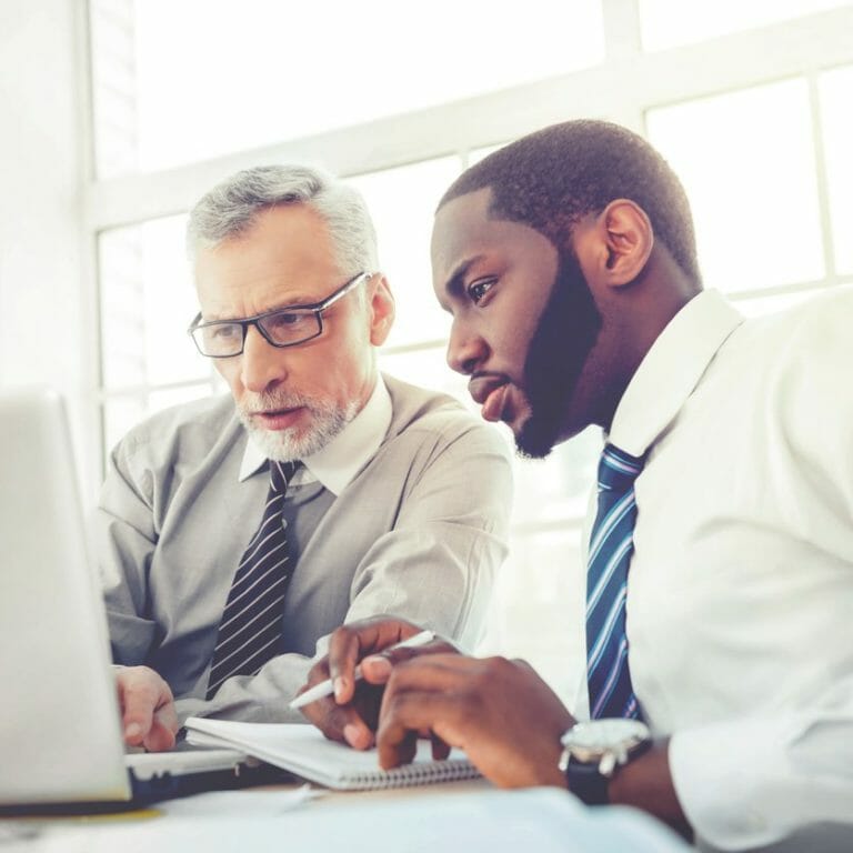 Men working on laptop