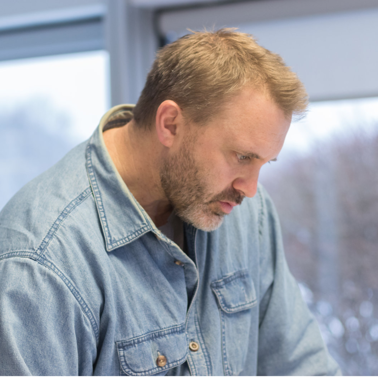 Man looking at notes