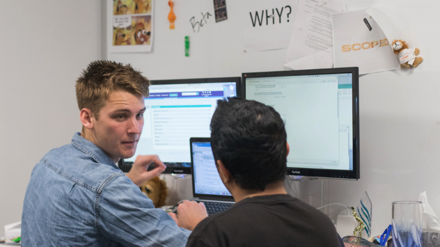 Two Coworkers looking at data